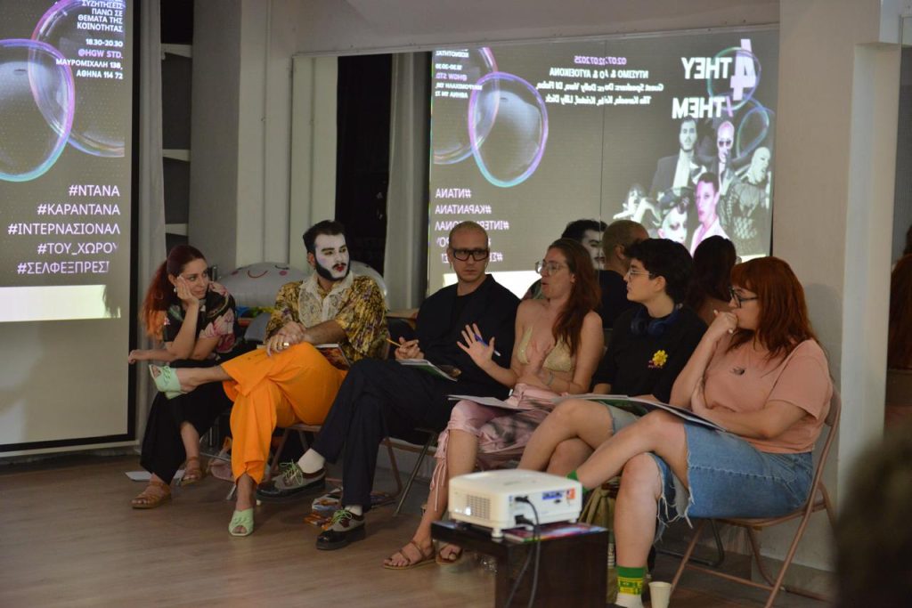 people sitting and discussing at one of the They/them activities