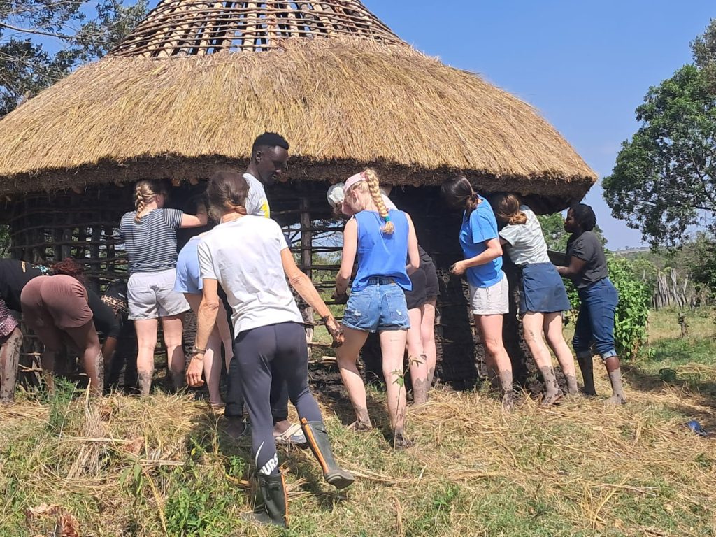 Volunteers building a manyatta