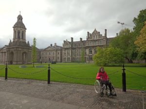 Senka in a wheelchair in front of a nice building