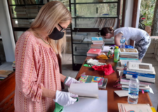 Volunteers cleaning and recording the books