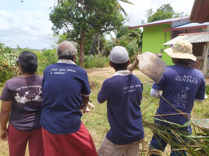 4 people's back while holding tools