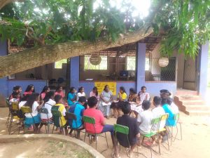 students and their teacher having a class outdoors