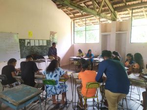 Students and their teacher in class