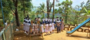 Some students and their teacher in a circle