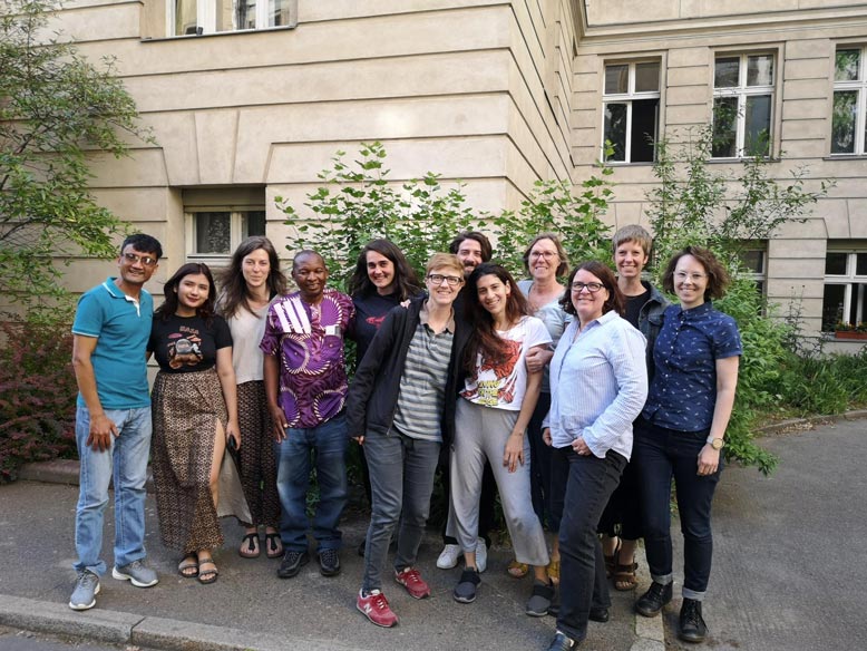 A group of people smiling for picture