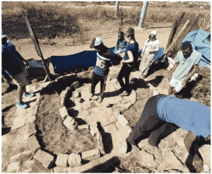 Group of people working with land and rocks