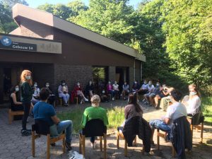 Participants having a meeting outside