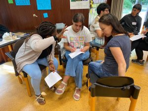 3 youth working on a task