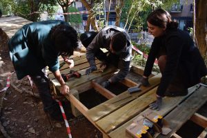 People building a wooden structure