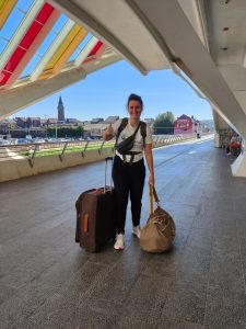 Elise getting ready for a trip with her bags close to her