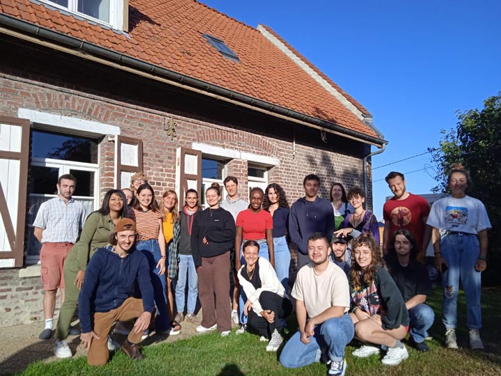 a group of people smiling for a picture